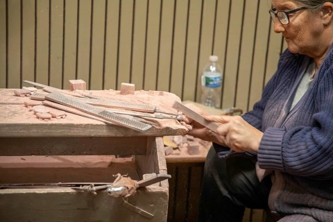 Pipestone, Minnesota, A Native American makes pipes from pipestone at Pipestone National Monument.