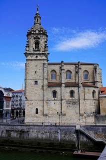 The church Iglesia de San Anton at the river Nervion in Bilbao, Historic church with stone bell