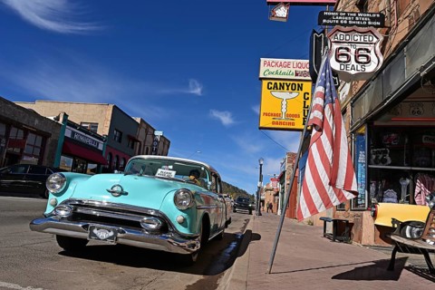Vintage car parked in front of souvenir shop on Route 66, Williams, Arizona