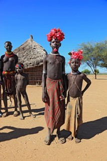 South Ethiopia, Omo region, tribal members of the Karo people, with floral decorations and body