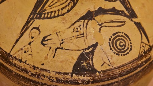 DetaiAntique vase with a picture of figures and animals, designed in black on a beige background,