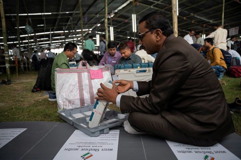 Barpeta, India. 6 May 2024. Polling officials check Electronic Voting Machines (EVMs) before