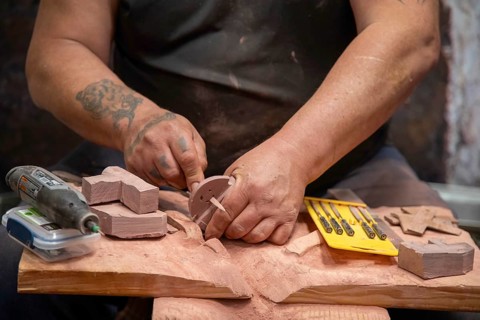 Pipestone, Minnesota, A Native American makes pipes from pipestone at Pipestone National Monument.