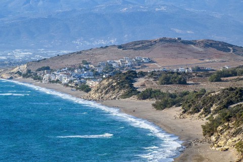 View from elevated position point of view on aerial view of beach of Komos Beach on south coast of