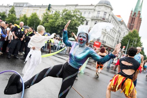 Dancer of the CABUWAZI children's and youth circus with hoops at the street parade of the 26th