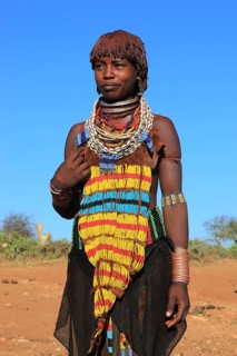 South Ethiopia, Omo region, young woman of the Hammer people, wears a lot of jewellery and her hair