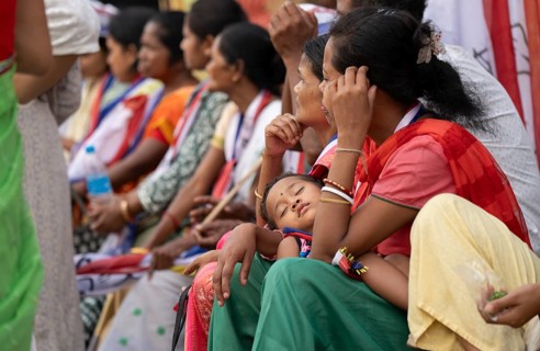 Bharatiya Janata Party (BJP) supporters arrives to to see a roadshow of Union Home minister Amit