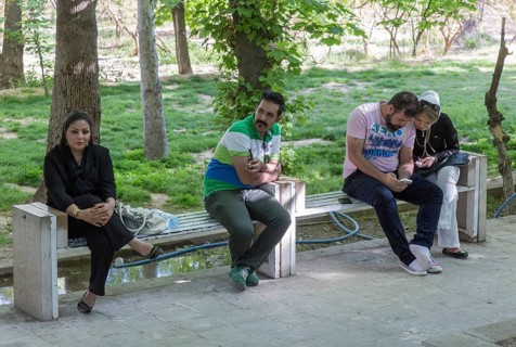 A young Iranian couple an Iranian woman and an Iranian man on 03/04/2015 sitting on a bench in the