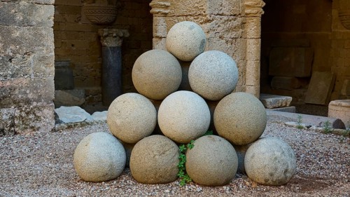 Stone pyramid made of cannonballs in an old fortress, outdoor area, Archaeological Museum, Old