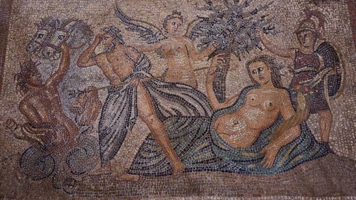 Antique mosaic of a scene with mermaids and sea creatures, Poseidon pursues Polybotes, stone