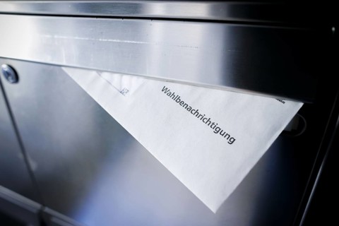 Symbolic photo: A polling card lying in a letterbox. Berlin, 14 May 2024