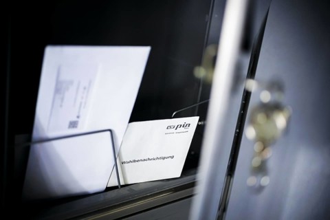 Symbolic photo: A polling card lying in a letterbox. Berlin, 14 May 2024