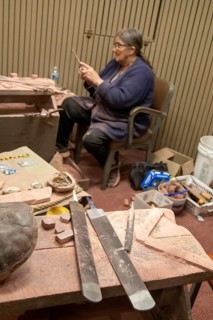 Pipestone, Minnesota, A Native American uses files in making pipes from pipestone at Pipestone