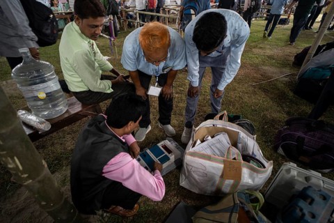 Barpeta, India. 6 May 2024. Polling officials check Electronic Voting Machines (EVMs) before