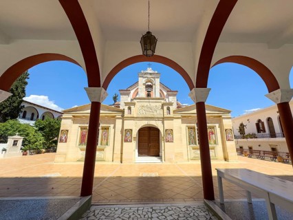 View through archway to main entrance portal of orthodox church monastery church Zoodochos Pege in