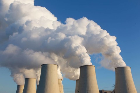 Steam rises from the cooling towers of the Vattenfall power plant in Jaenschwalde on 9 December