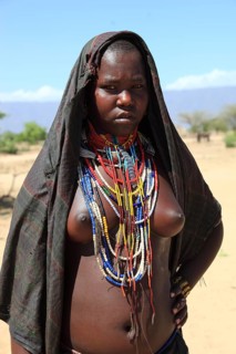 South Ethiopia, in a village of the Arbore or Erbore people at Lake Stefano, young woman wearing