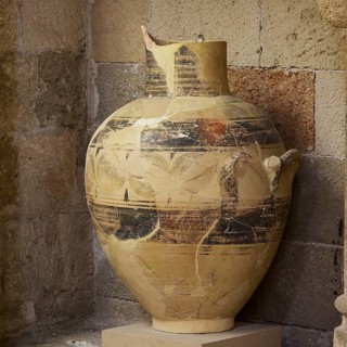 Large antique vase with detailed pattern and golden colour, stone-like, interiors, Archaeological