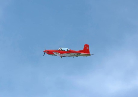 Two-seater Pilatus PC-7 turboprop training aircraft of the Swiss Air Force in flight, Payerne