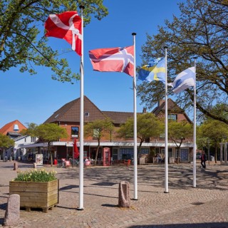 Scandinavian flags on the town hall square in Niebuell, Nordfriesland district, Schleswig-Holstein,