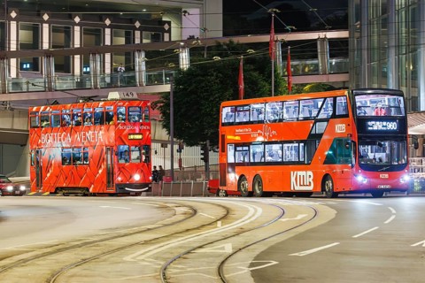 Hong Kong Tramway double-decker tram and bus public transport on Des Voeux Rd in Hong Kong, China,