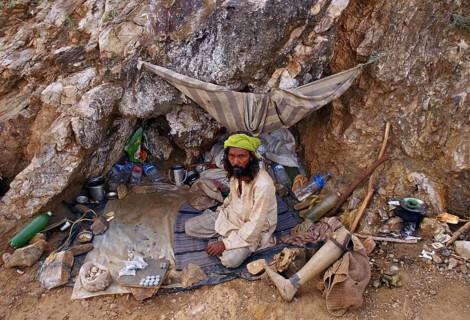 Muslim amputated man, beggar seen at the place where he lives, waiting for alms from pilgrims,