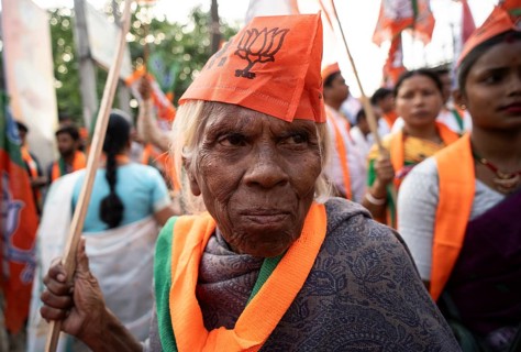 Bharatiya Janata Party (BJP) supporters arrives to to see a roadshow of Union Home minister Amit