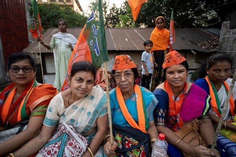 Bharatiya Janata Party (BJP) supporters waiting, to to see a roadshow of Union Home minister Amit