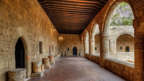 HDR shot, Long corridor in a historic building with Gothic arcades, medieval architecture, outdoor