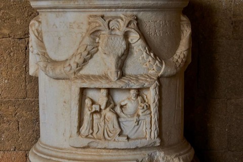 Ancient relief in a stonework with carved figures and a scene, interiors, Archaeological Museum,
