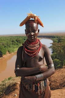 Southern Ethiopia, Omo region, Omo river landscape, proud woman of the Karo people with headdress,