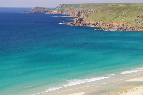 Wide sandy beach, cliffs and green countryside, Sennen Bay, Cornwall, Great Britain