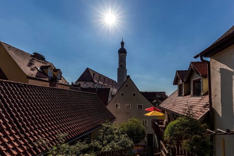 Alley in the old town of Landsberg am Lech, behind the church tower of the parish church Mariae