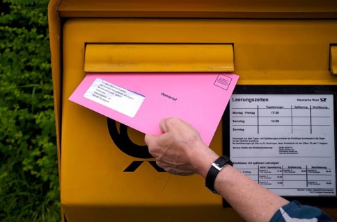 Postal ballot, letterbox, insert ballot paper envelope, light red, pink, European elections,