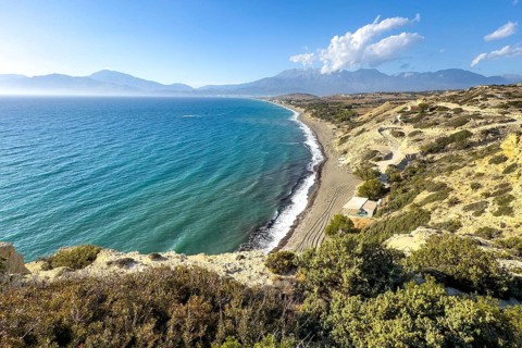 View from elevated position point of view on aerial view of beach of Komos Beach on south coast of