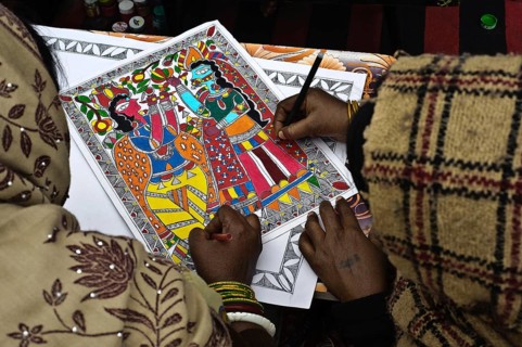 Women taking drawing lessons in a drawing school, learning the Madhubani style of painting, Bihar,