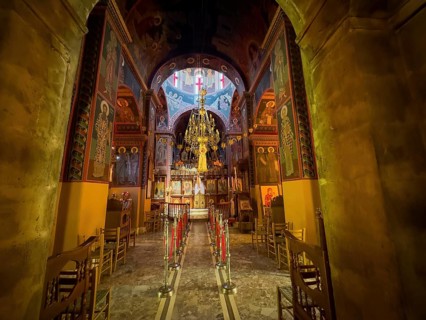 View into chancel interior of orthodox church with chandelier in the background Chandelier under