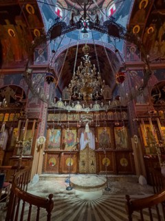 Chancel interior of orthodox church with in the background chandelier chandelier under dome of