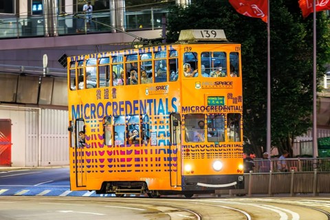 Hong Kong Tramway double-decker public transport on Des Voeux Rd in Hong Kong, China, Asia