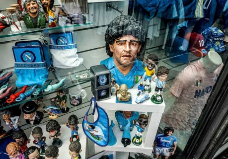 Diego Maradonna figurine in a souvenir shop. Maradonna brought success to SSC Napoli in the 1980s,