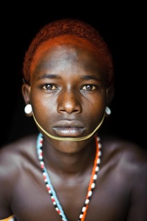 Portrait of a teenage boy from the Samburu tribe, Kenya. He has completed his initiation rite and