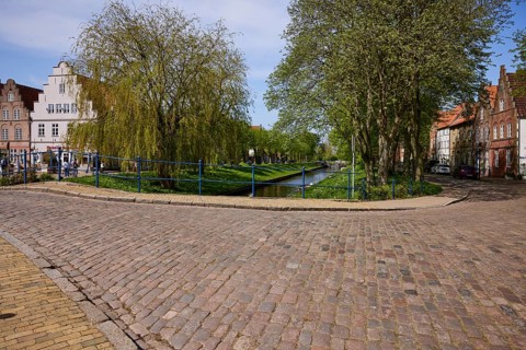 The Great Bridge over the Mittelburggraben with gabled houses and cobbled street in Friedrichstadt,