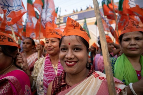 Bharatiya Janata Party (BJP) supporters arrives to to see a roadshow of Union Home minister Amit