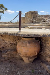 View into historical storeroom below present floor level with large decorated clay vessel Pithoi in