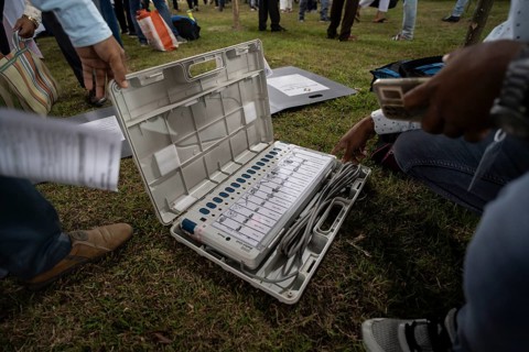 Barpeta, India. 6 May 2024. Polling officials check Electronic Voting Machines (EVMs) before
