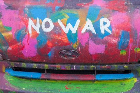 Lettering No War, kein Krieg, colourfully painted vintage car, colour surface, Germany, Europe