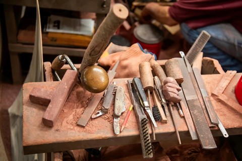 Pipestone, Minnesota, A Native American makes pipes from pipestone at Pipestone National Monument.