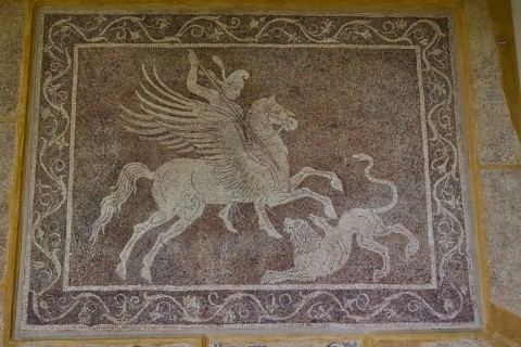 Ancient mosaic with Bellerophon on horse Pegasus fighting a chimera, surrounded by decorative