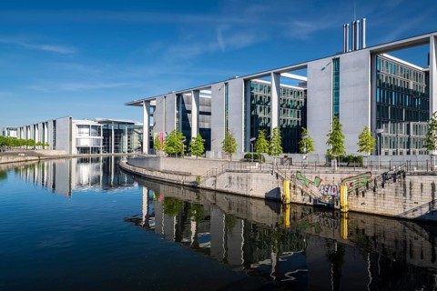 Reichstag, Paul-Loebe-Haus and Marie-Elisabeth-Lueders-Haus reflected in the Spree at sunrise,