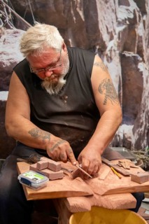 Pipestone, Minnesota, A Native American makes pipes from pipestone at Pipestone National Monument.